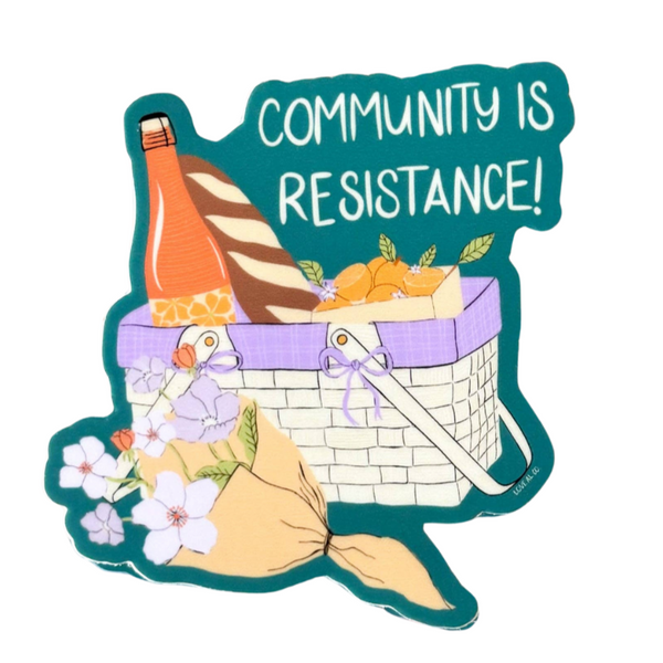 Sticker of a picnic basket with flowers and a bottle, featuring the text 'Community is Resistance!' 