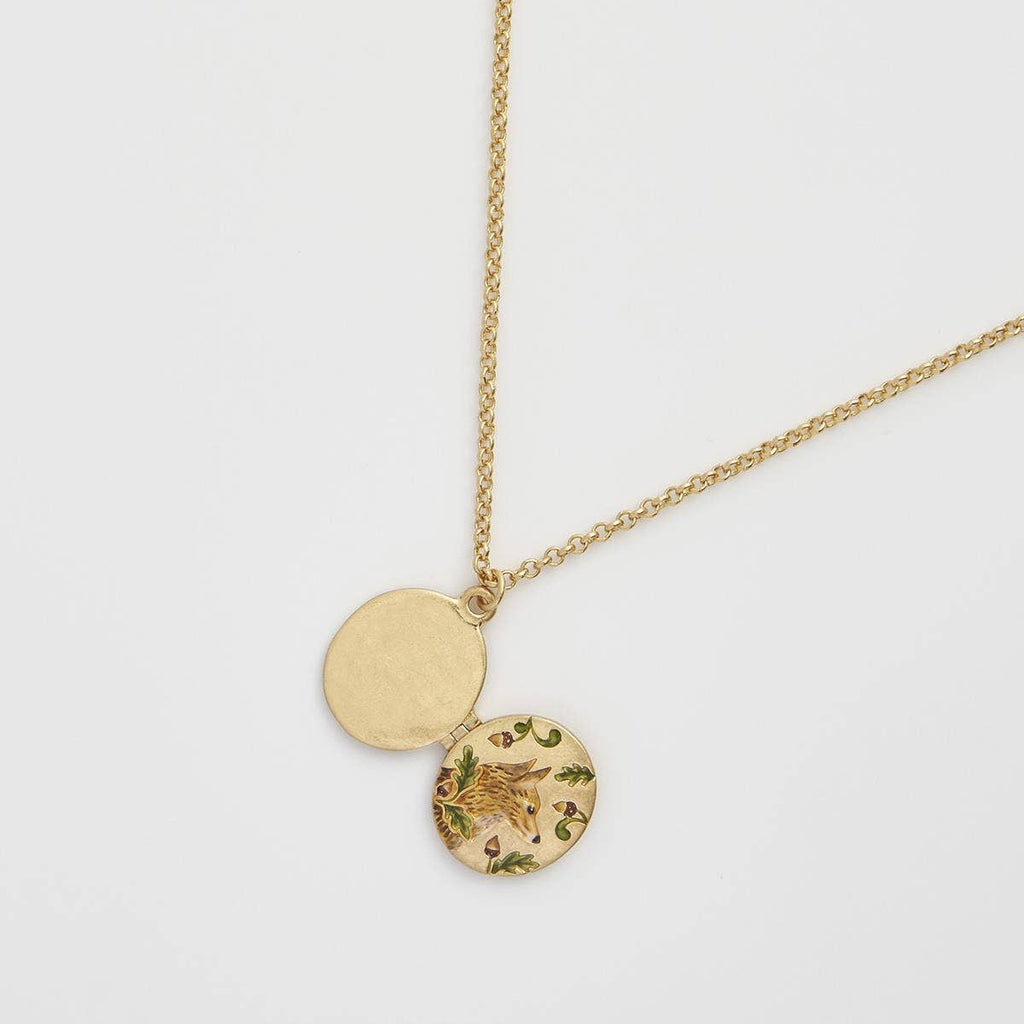 Vintage-style enamel locket necklace by Fable England featuring intricate fox and acorn design on a silver chain.