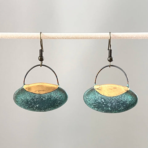 Patina green oval clay earrings by The Artifact House, showing smooth, handcrafted ceramic jewelry with a glossy finish.