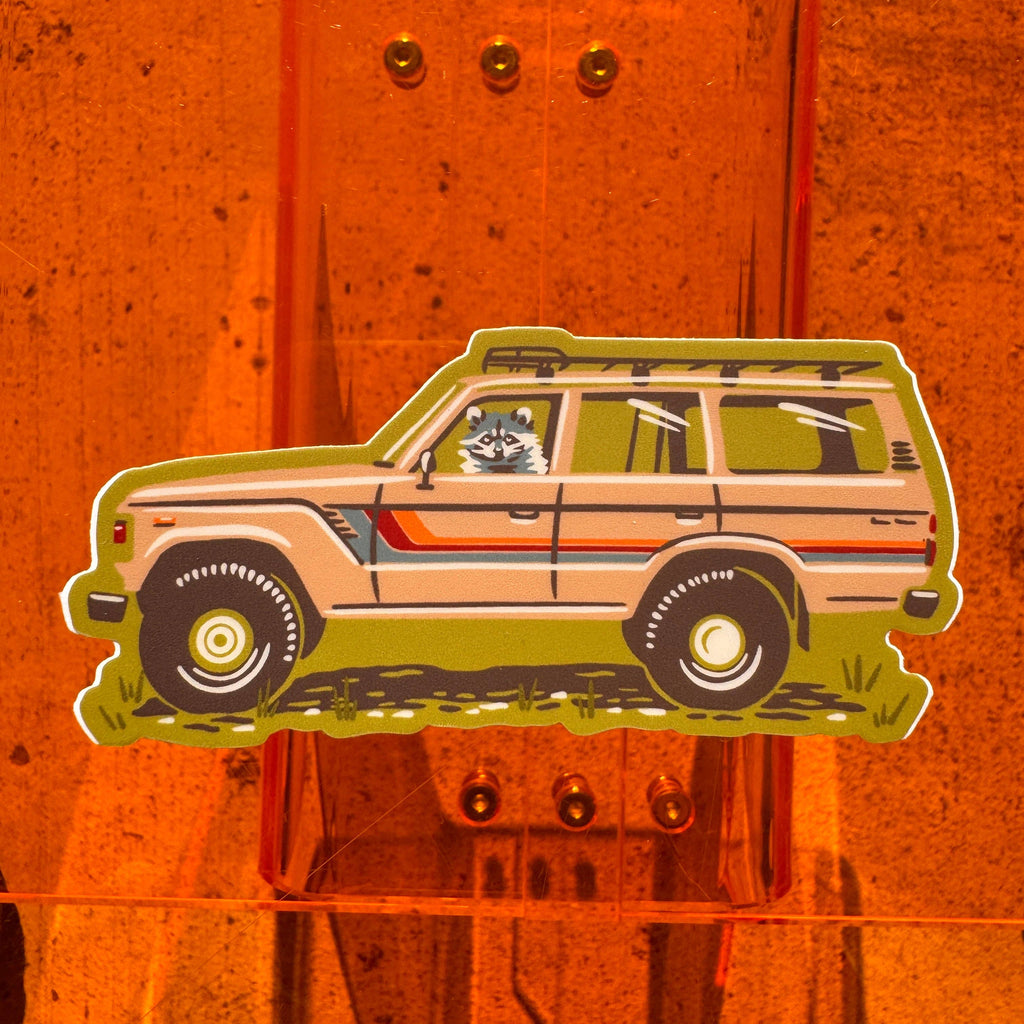 Caroline Clark Camping Cruiser sticker with a colorful outdoor vehicle illustration