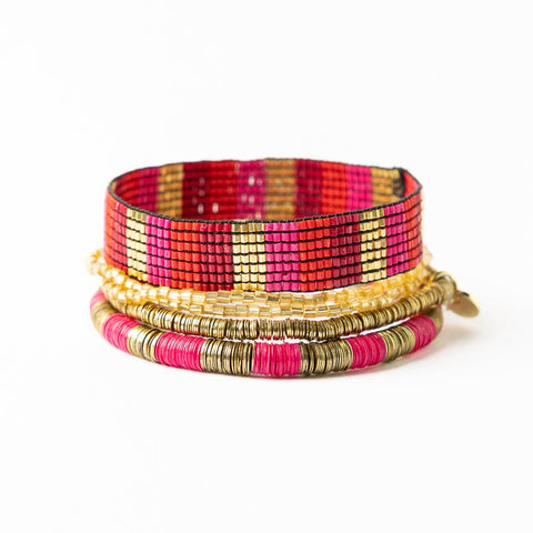 Stack of Alex & Grace hot pink and gold bracelets by Ink + Alloy, featuring vibrant pink and shiny gold accents.