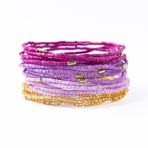 Ink + Alloy Chelsea Luxe purple beaded bracelet stack featuring 18 stylish beaded bracelets on a neutral background.