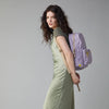 Lavender organic cotton backpack by Fluf, featuring adjustable straps and spacious main compartment, in a natural fabric finish.