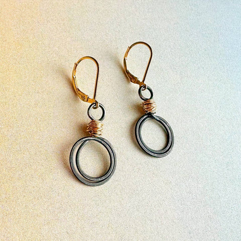 Antique gold swirl loops earrings by Freshie & Zero featuring elegant, intricate gold hoop design with a vintage-inspired style.