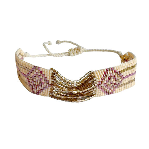 Gold and pink beaded bracelet from Powder Design featuring intricate beaded details and stylish craftsmanship.