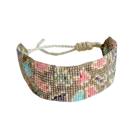 Gold leopard beaded bracelet by Powder Design featuring intricate powder beads and a stylish leopard pattern.