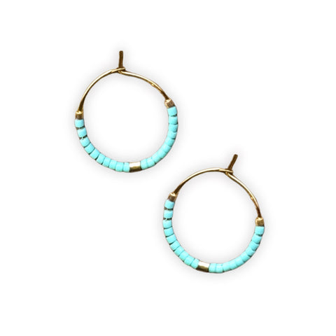 Colorful beaded hoop earrings by Ocean Breakup featuring small, vibrant beads on gold-tone hoops.