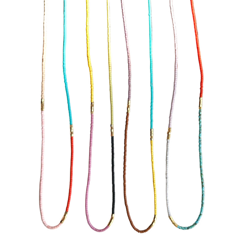 Colorful beaded choker necklace by Ocean Breakup featuring small dainty beads in vibrant hues, perfect for stylish jewelry accents.