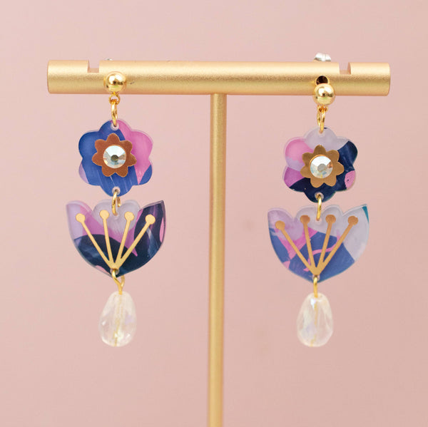 Handpainted flower acrylic dangle earrings by Jill Makes, featuring vibrant floral designs and lightweight earring hooks.