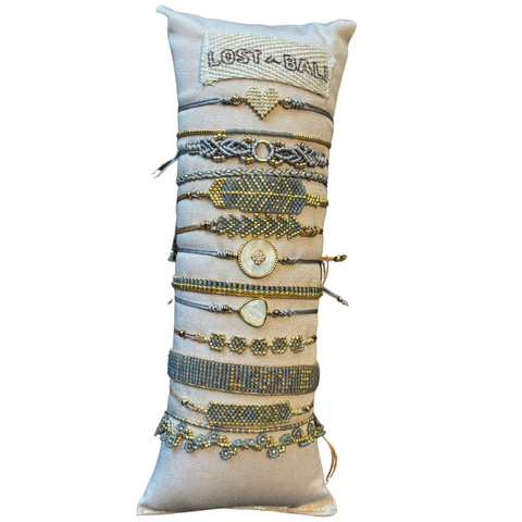 Lost in Bali Camila gray and gold bracelets featuring layered designs and delicate details, perfect for stylish accessories.