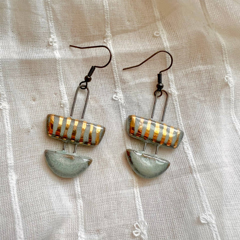 Two-piece turquoise striped ceramic clay earrings with handcrafted design, featuring vibrant patterns and a smooth finish.