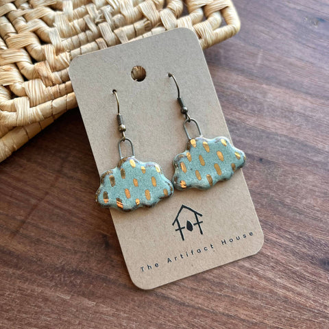 Large ceramic charm earrings featuring storm cloud design by The Artifact House, with dark and cloudy aesthetic.