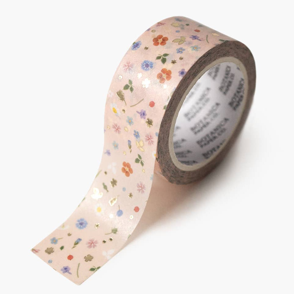 Pink floral confetti washi tape from Botanica Paper Co. shown rolled out with colorful floral patterns and delicate confetti design
