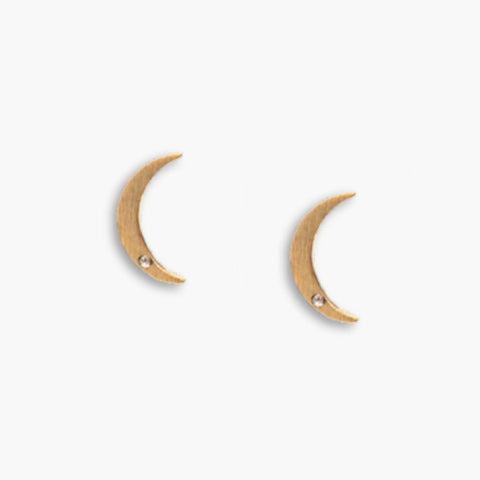 Gold crescent moon stud earrings by Nude San Francisco, small and stylish jewelry for pierced ears.