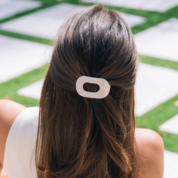 Tiny flat round TELETIES clip for hair accessories, small, sleek, and lightweight hair clip for securing hair styles.