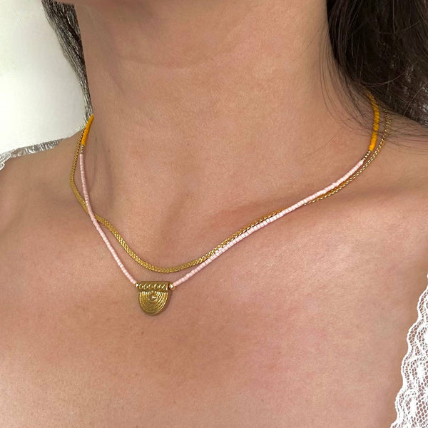 Gold beaded pendant necklace from Ocean Breakup featuring delicate Mallorca style design and subtle beaded accents.