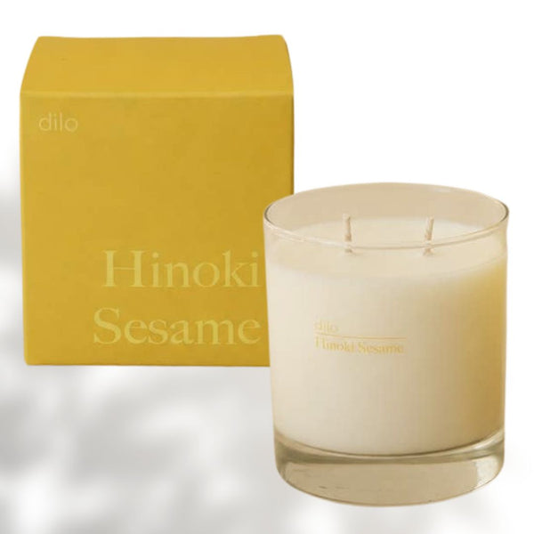 Dilo Hinoki Sesame Candle in a glass holder, showcasing a soothing candle with hinoki and sesame scent for ambiance.