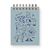 Notebook with dog illustrations on a light blue background