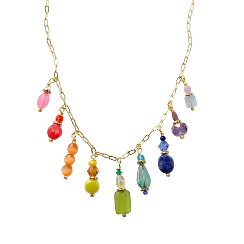 Rainbow charm necklace by Jill Makes featuring colorful rainbow pendant on a silver chain, stylish and vibrant jewelry piece.