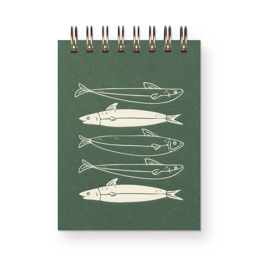 Green notebook with white fish illustrations on a white background