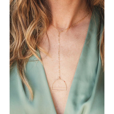 Freshie & Zero Porta necklace featuring a sleek, minimalist design with a silver chain and pendant, displayed on a neutral background.