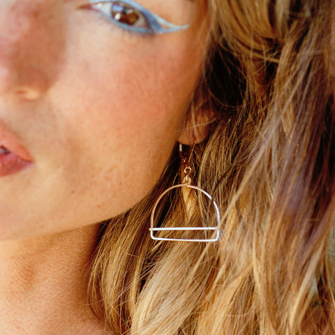 Freshie & Zero Porta earrings featuring minimalist hoop design with sleek silver finish.