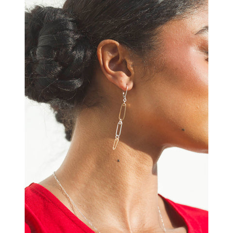 Golden mini reef earrings by Freshie & Zero featuring delicate reef-inspired design and small hoop style.