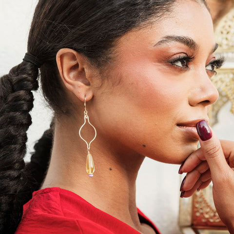Butter yellow Ogee Drop Earrings by Freshie & Zero featuring elegant, curved earring design on a white background.