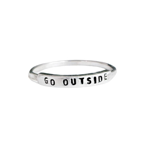 Handmade GO OUTSIDE ring by Christina Kober featuring a sleek white design, crafted with detailed artistry, perfect for everyday wear.