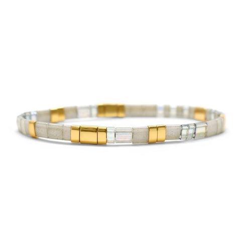 Stia Couture Morse code Tila bracelet with gratitude message, featuring small bead details and adjustable cord for a stylish look.