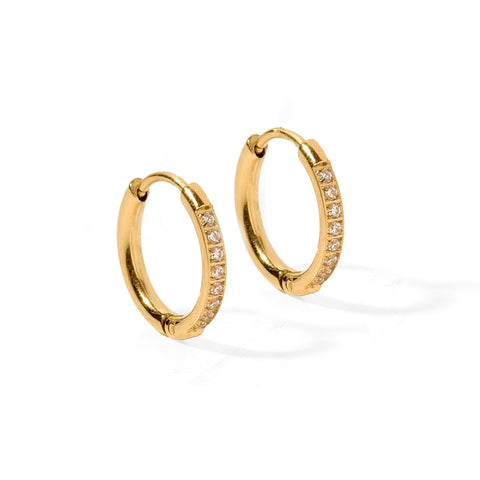Gold crystal huggie hoops earrings by Linny Co featuring 12mm size, waterproof design, and sparkling cubic zirconia accents.