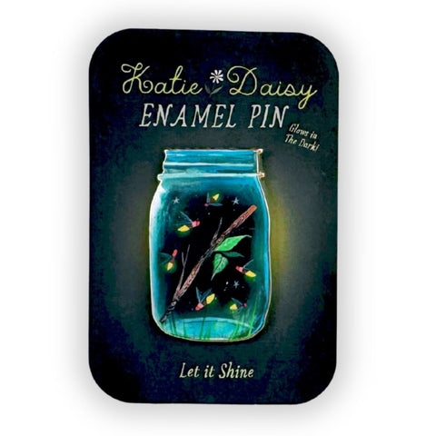 Katie Daisy Firefly Jar enamel pin, colorful accessories featuring a whimsical firefly design on a clear background.