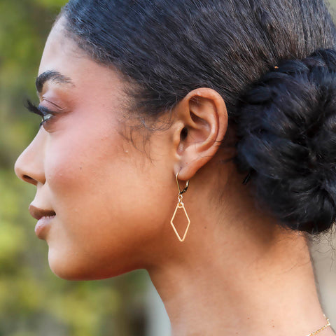 Freshie & Zero Little Mirage earrings featuring delicate, shimmering design with gold-tone accents and intricate detailing.