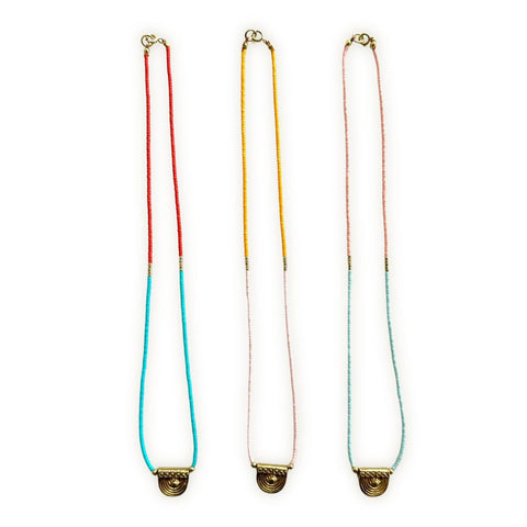 Gold pendant necklace with delicate beaded design from Ocean Breakup's Mallorca Dainty Beaded Necklace collection.