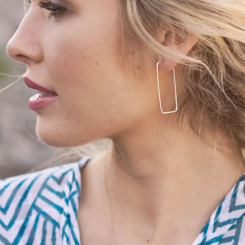 Freshie & Zero minimal rectangle hoop earrings with refracting petal design, showcasing warm, elegant jewelry for modern style.