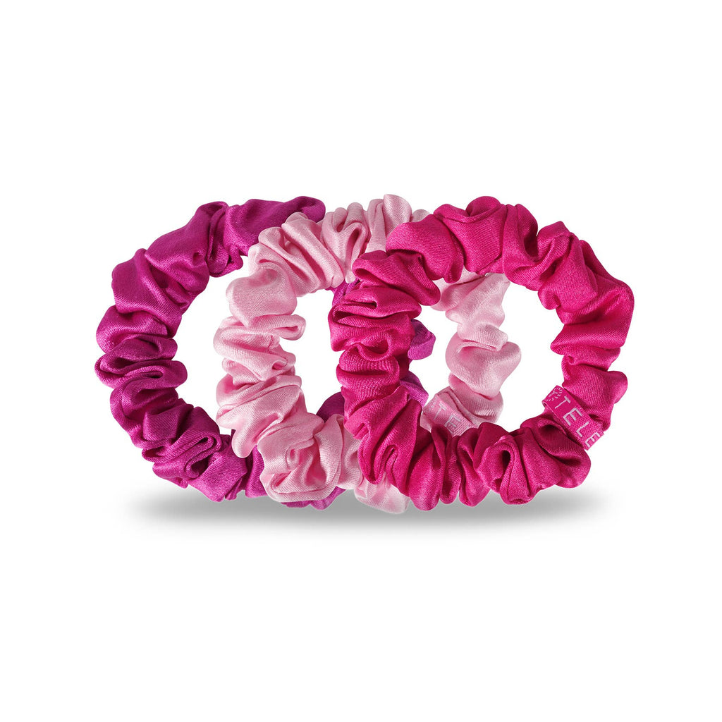 Set of three small TELETIES silk scrunchies in rose color, soft hair accessories for gentle hold and stylish hair styling.