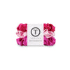 Set of three TELETIES small silk scrunchies in rose color, soft hair accessories for gentle hold and stylish hair styling.