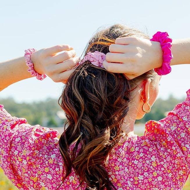 Set of three small TELETIES silk hair scrunchies in soft rose color, perfect for gentle, stylish hair accessories.
