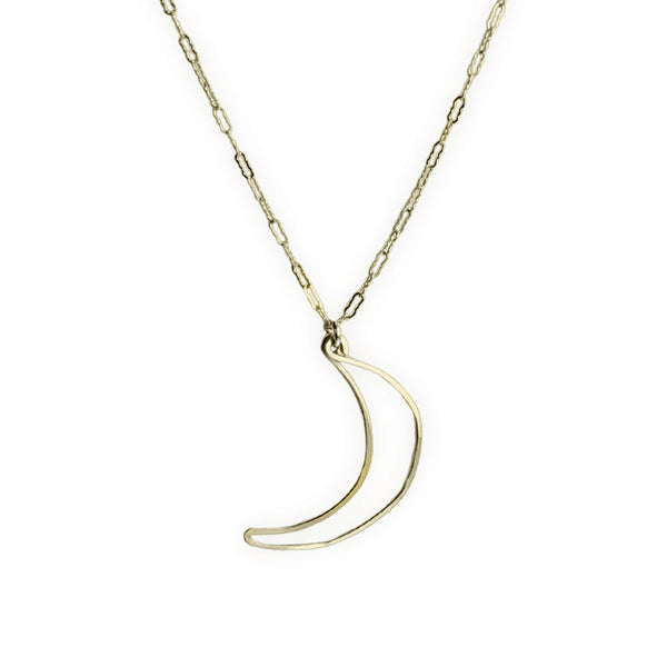 A delicate gold chain necklace featuring a thin, open crescent moon pendant, displayed against a solid white background.