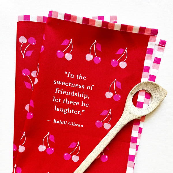 Pink cherries cotton tea towel from J Falkner, featuring a charming cherry pattern, perfect for kitchen and dish drying.