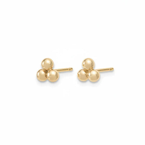 Assorted gold stud earrings featuring three small beads on each earring, showcasing a minimalist and elegant jewelry style.