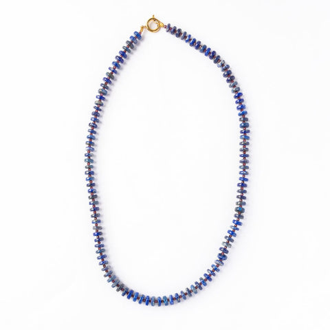 Vivianne Lapis and Garnet Necklace by Ink + Alloy featuring a silver chain with deep blue lapis and red garnet stones.