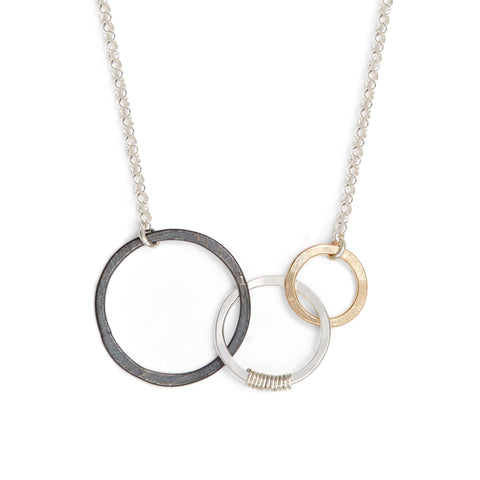 Freshie & Zero Storied Necklace featuring symbolic charms representing past, present, and future on a sleek silver chain.
