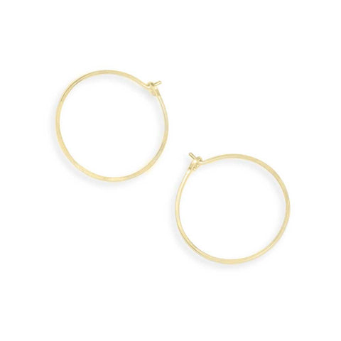 Small gold hoop earrings from Freshie & Zero featuring minimalist circular design, perfect for everyday wear.