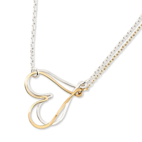 Silver coupled hearts necklace by Freshie & Zero featuring intertwined heart pendants on a delicate chain.