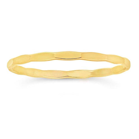 Assorted gold filled faceted stacking rings, close-up view showing sparkling textured surfaces and thin band design.