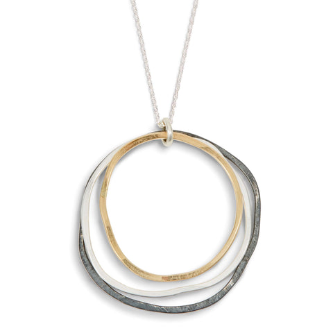 Mixed Caldera necklace by Freshie & Zero featuring layered silver and gold-tone pendants on a delicate chain.