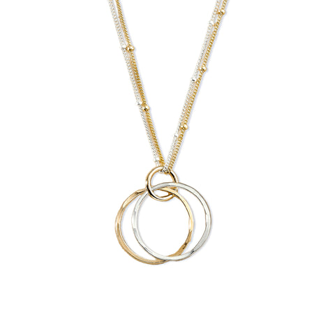 Gold GLAM Orbits necklace by Freshie & Zero, featuring layered circular pendant design on a delicate chain.
