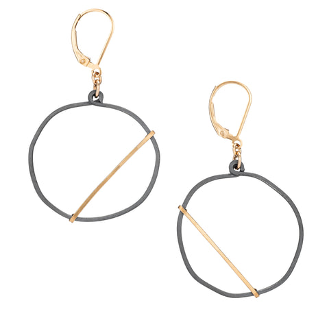 Freshie & Zero Night Optimist earrings featuring delicate silver hoops with moon and star charms on a white background.