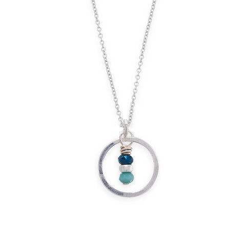 Seedling Azure Necklace by Freshie & Zero featuring a delicate blue pendant on a silver chain.
